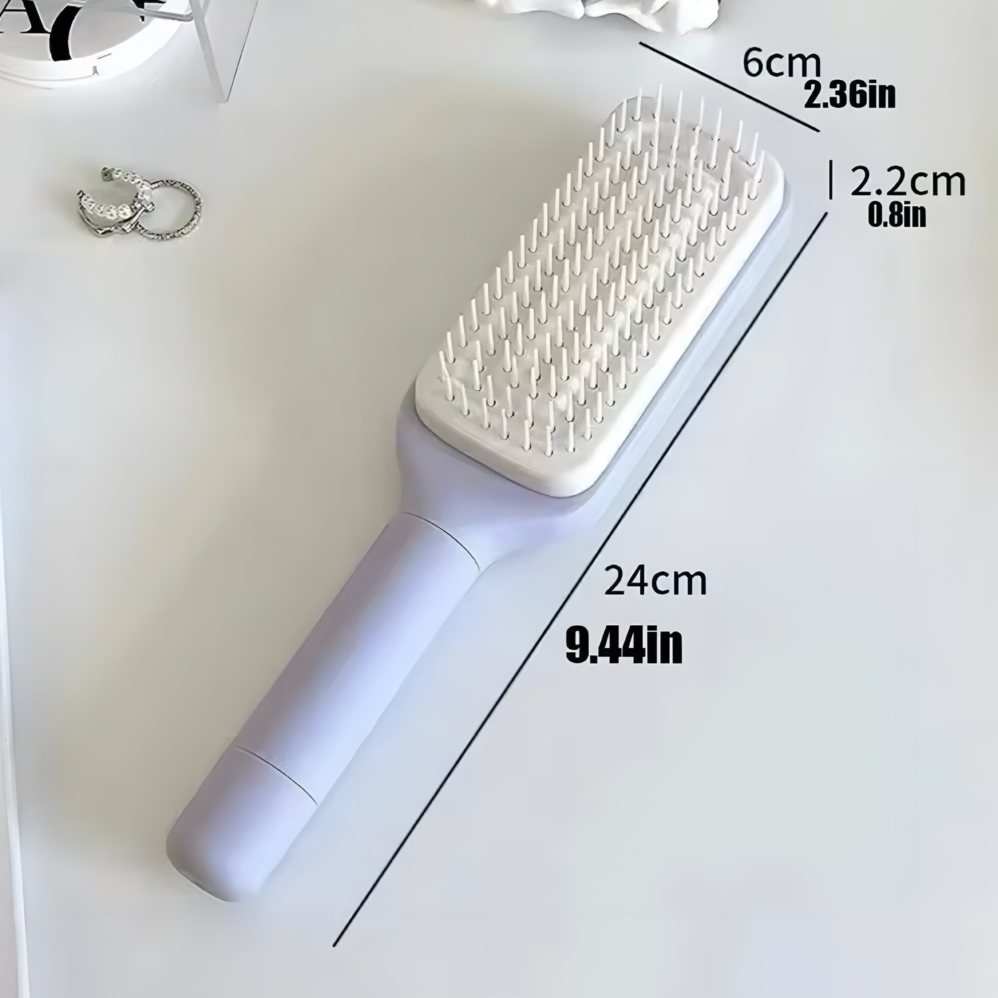 Selbstreinigende Rotationshaarbürste mit Liftkamm